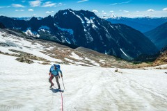 Carly working up the sunny glacier.  Views for miles.