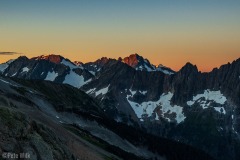 The sun just kissing the tops of the surrounding peaks.