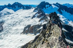 I lead some of the middle section of the East Ridge (5.8) with the middle of the three gendarms.  I'm bringing Carly and Micah along a knife edge ridge which required some au cheval.